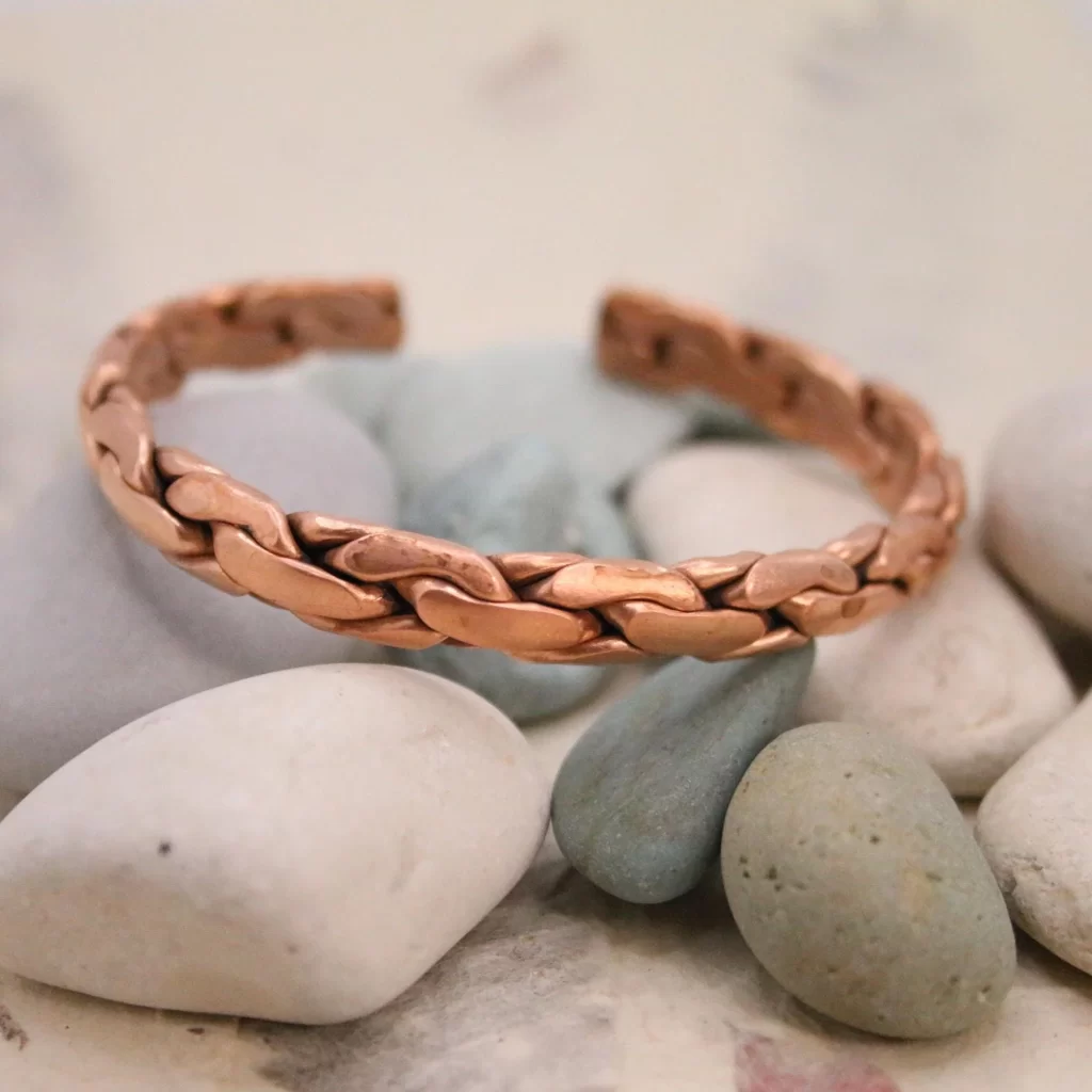 Close-up of men's copper bracelet braided texture