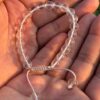 clear quartz natural gemstone bracelet in palm