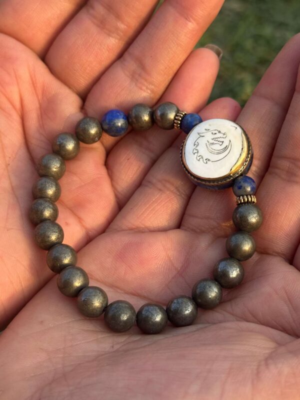 gold obsidian natural gem stone bracelet with guru bead in both palm