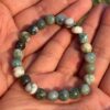 indian agate natural gemstone bracelet in palm
