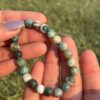 indian agate natural gemstone bracelet in palm close view