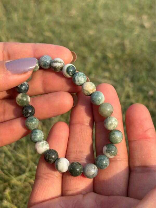 indian agate natural gemstone bracelet in palm close view