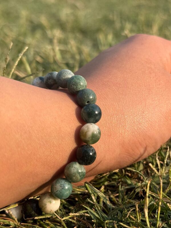 indian agate natural gemstone bracelet in left hand