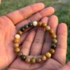 mookaite jasper natural gemstone bracelet in palm