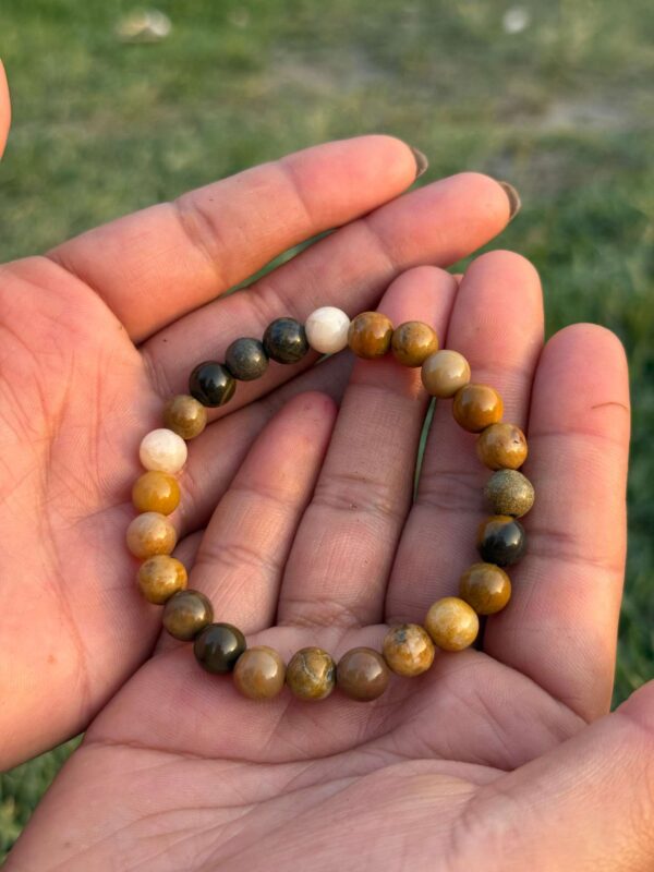 mookaite jasper natural gemstone bracelet in palm