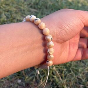 mother of pearl natural gemstone bracelet in hand