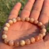 picture stone natural gem stone bracelet in one palm
