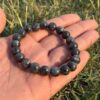 polar zade natural gem stone bracelet in hand