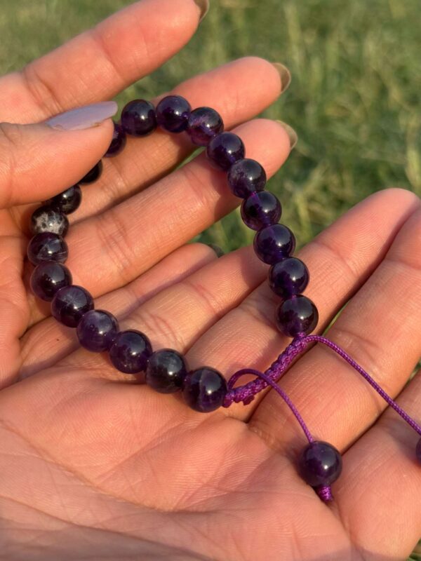 purple agate natural gem stone bracelet in hand