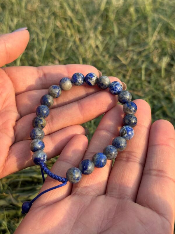 sodalite natural gemstone bracelet in hand