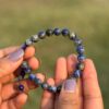 sodalite natural gemstone bracelet in hand close view
