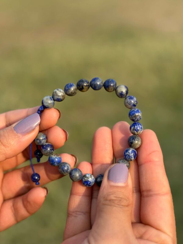 sodalite natural gemstone bracelet in hand close view