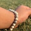white howlite natural gemstone bracelet in left hand side view